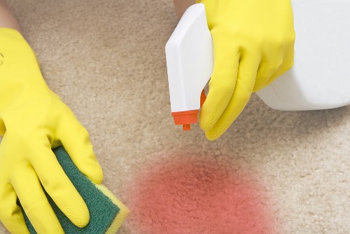 Professional carpet cleaner in SW9 deep cleaning a living room carpet